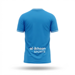 A bright blue short-sleeve athletic jersey shown from the back, featuring white trim on the collar and sleeve cuffs, with 'al-ikhsan SPORTS' printed in white across the lower back. The jersey is presented on a clean white background with a soft drop shadow.