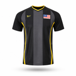 A short-sleeve athletic jersey with vertical black and dark gray stripes, yellow piping details, a yellow logo on the right chest, and a Malaysian flag patch on the left chest, shown on a white background with a soft shadow.