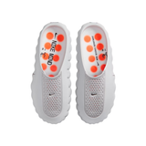 Top view of grey Nike Mind 001 men slippers with orange circular patterns on the insole