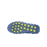 Blue Nike Mind 002 training shoe outsole with yellow circular traction pods
