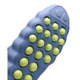 Blue Nike Mind 002 training shoe outsole with yellow circular traction pods