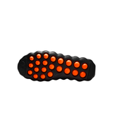 Black Nike Mind 002 women training shoe outsole with orange circular traction pods