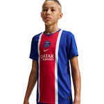 Child wearing a red, white, and blue sports jersey with a logo on a white background