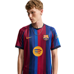 Person wearing a Barcelona soccer jersey with Nike logo on a white background