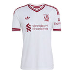 A white short-sleeve soccer jersey with red trim, featuring the Adidas logo, Liverpool FC crest, 'standard chartered' sponsor logo, and 'Expect' sleeve logo, shown on a plain white background.