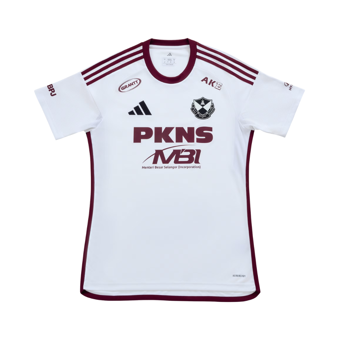 A white short-sleeve soccer jersey with maroon trim, featuring the PKNS and MBI logos on the front, the Adidas logo, and the AKS logo. The jersey is displayed flat against a solid white background.