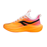 A single athletic running shoe shown in a side profile on a plain white background. The upper is primarily bright orange with a pink-to-white gradient near the heel, a black side logo, white laces, and a thick orange sole.